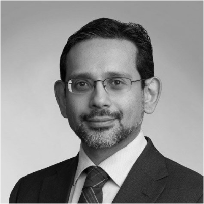 Headshot of Imran Ahmed, greyscale