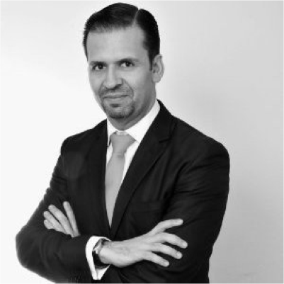 Headshot of Carlos Carillo, greyscale